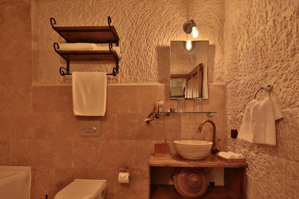 Private bathroom sink and toiletries in the bookable Cave Suite at The Owl Cave Hotel in Göreme